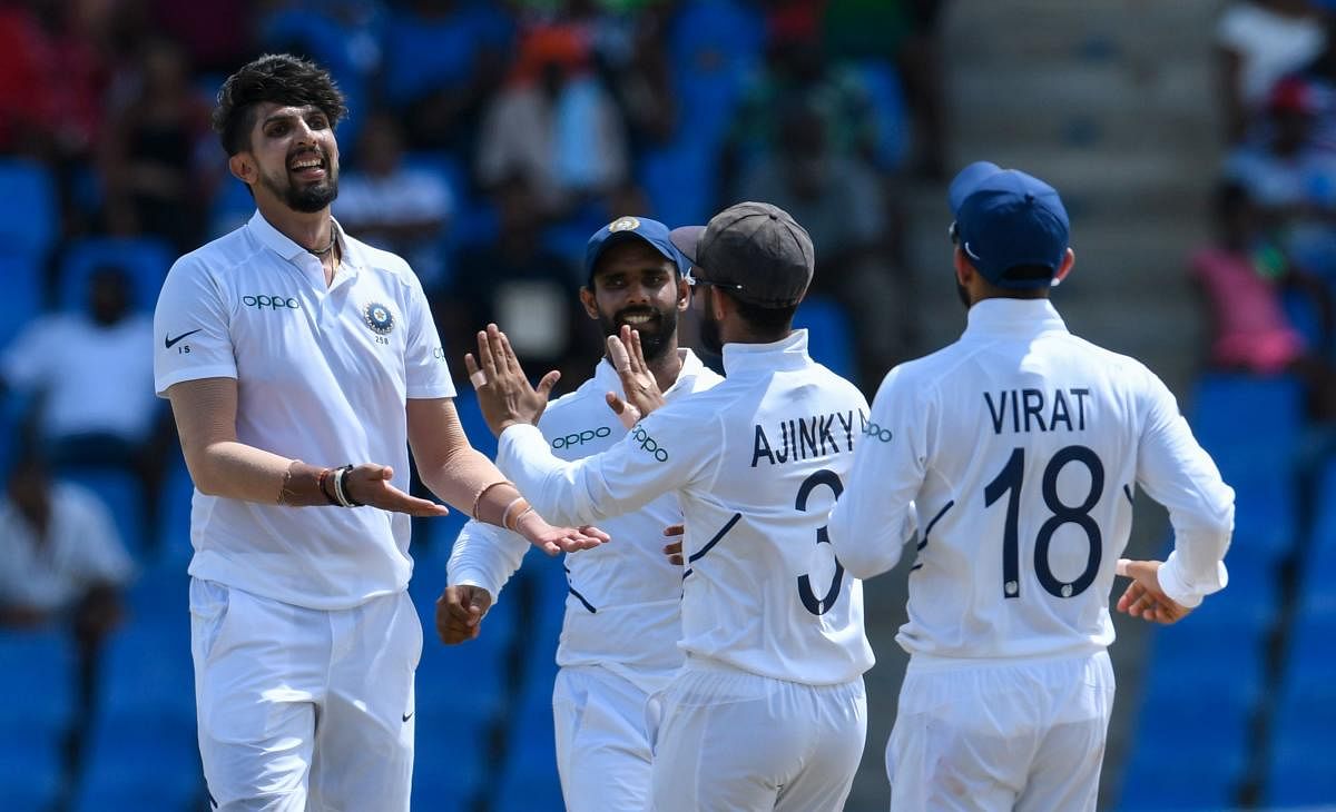 India's bowlers shared the spoils in putting the West Indies on the back foot at 82 for three in reply to their opponents first innings total of 297 at tea on the second day of the first Test. (AFP Photo)