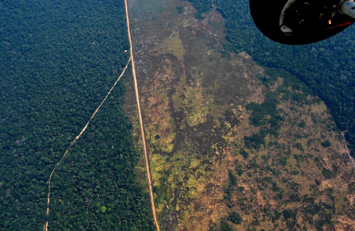 Aerial picture showing a deforested piece of land in the Amazon rainforest near an area affected by fires, about 65 km from Porto Velho, in the state of Rondonia, in northern Brazil. (AFP Photo)