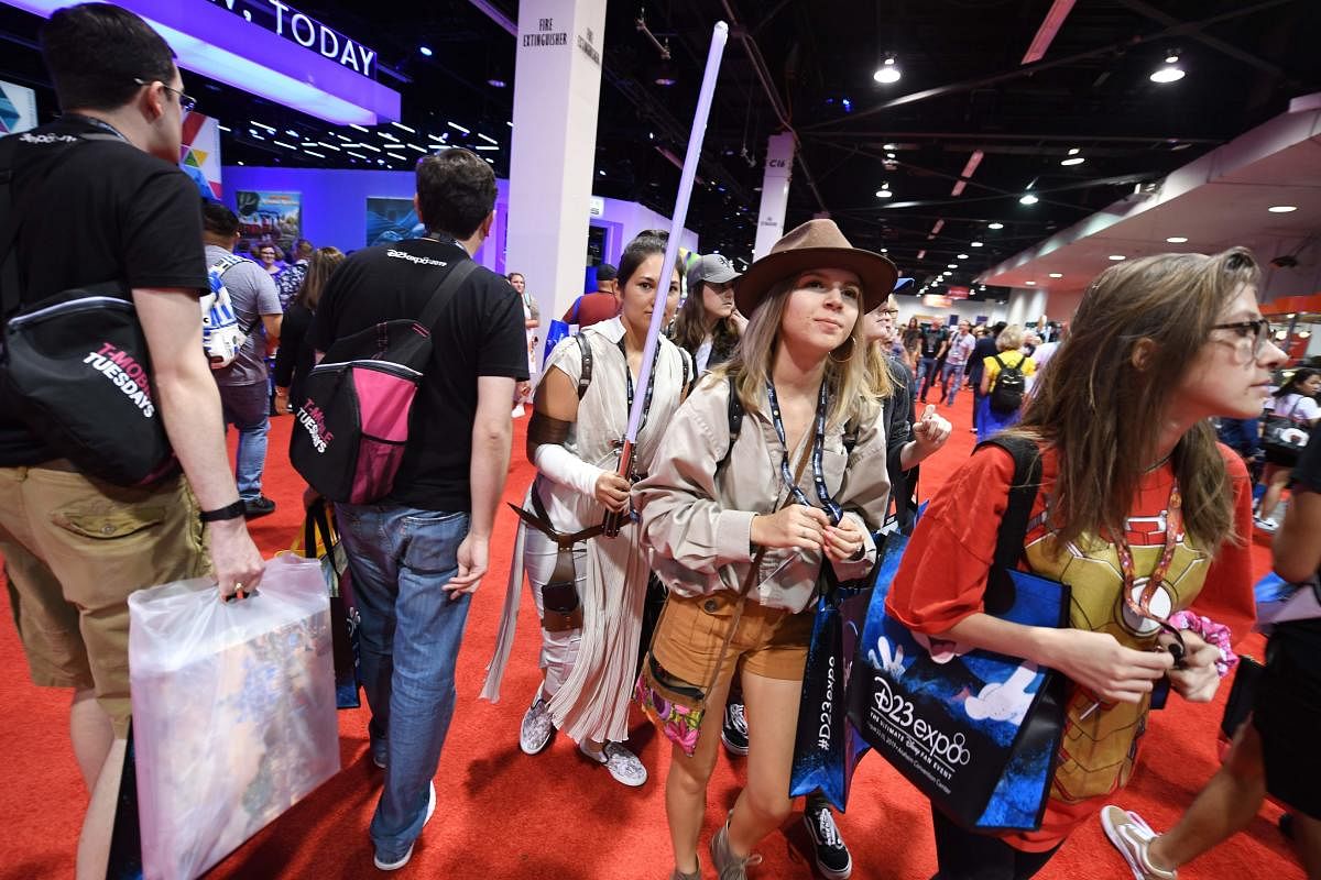 Attendees visit the main hall at the D23 Expo, billed as the "largest Disney fan event in the world," on August 23, 2019 at the Anaheim Convention Center in Anaheim, California. (Photo by AFP)