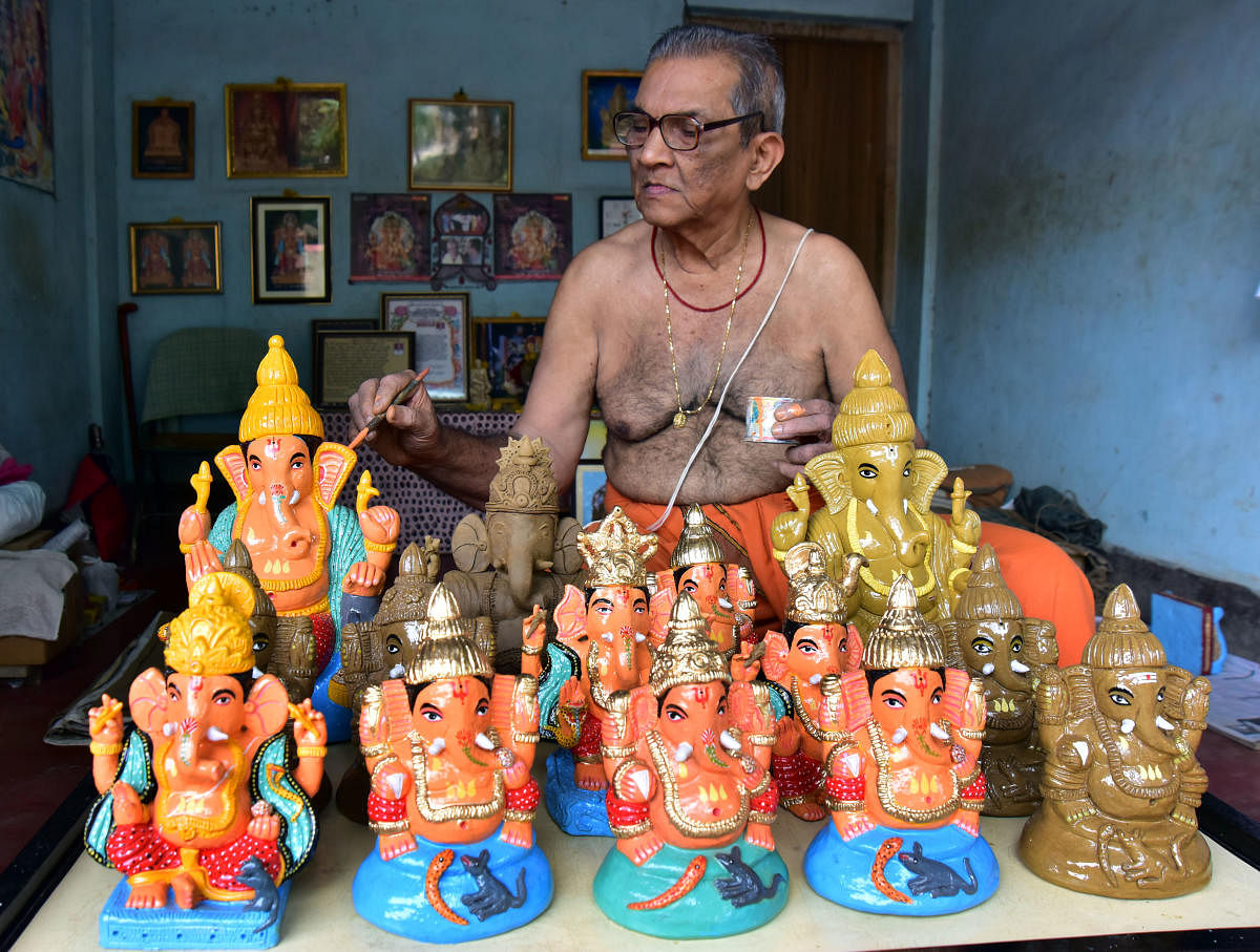 Damodar Shenoy, who is engaged in making Ganesha idols for the last 60 years, gives final touches to an idol of Lord Ganesha in Car Street in Mangaluru.