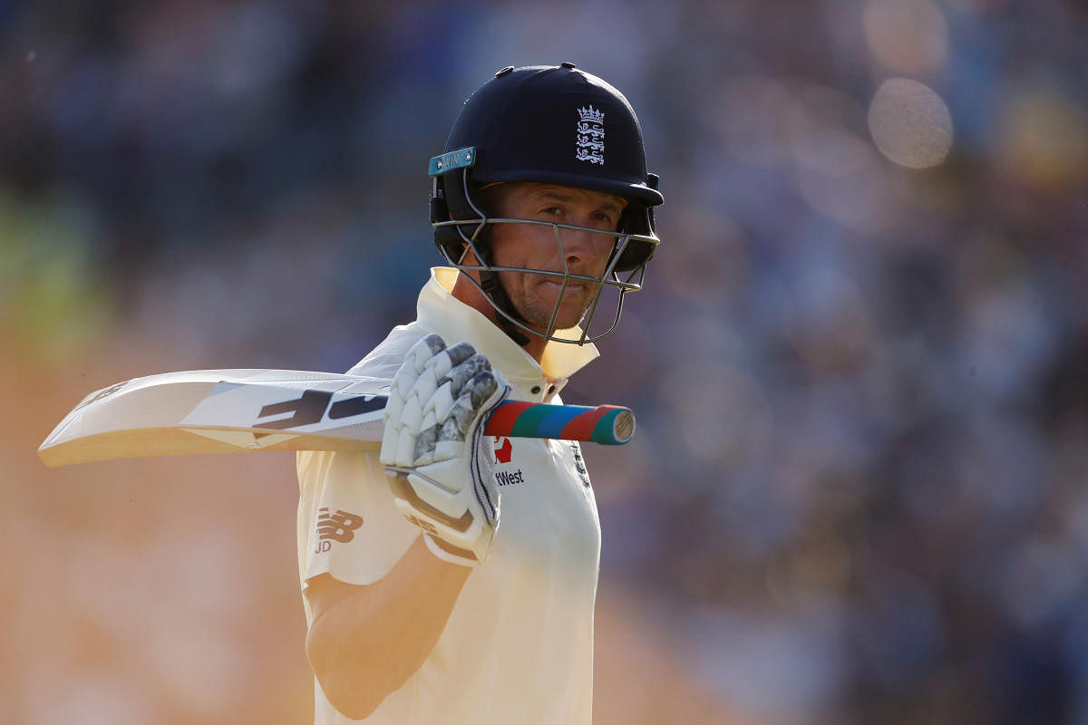 England's Joe Denly walks after losing his wicket. (Photo by Reuters)