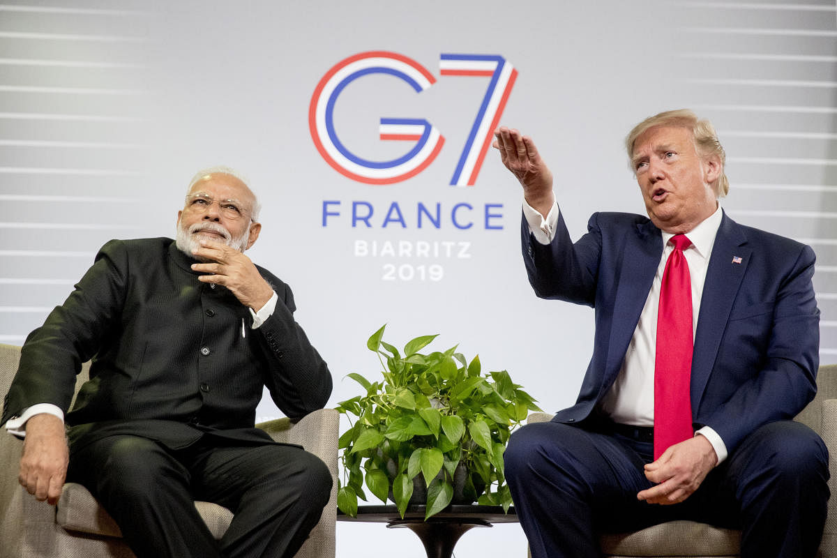 President Donald Trump, accompanied by Indian Prime Minister Narendra Modi, left, speaks during a bilateral meeting at the G-7 summit in Biarritz, France. (AP Photo)