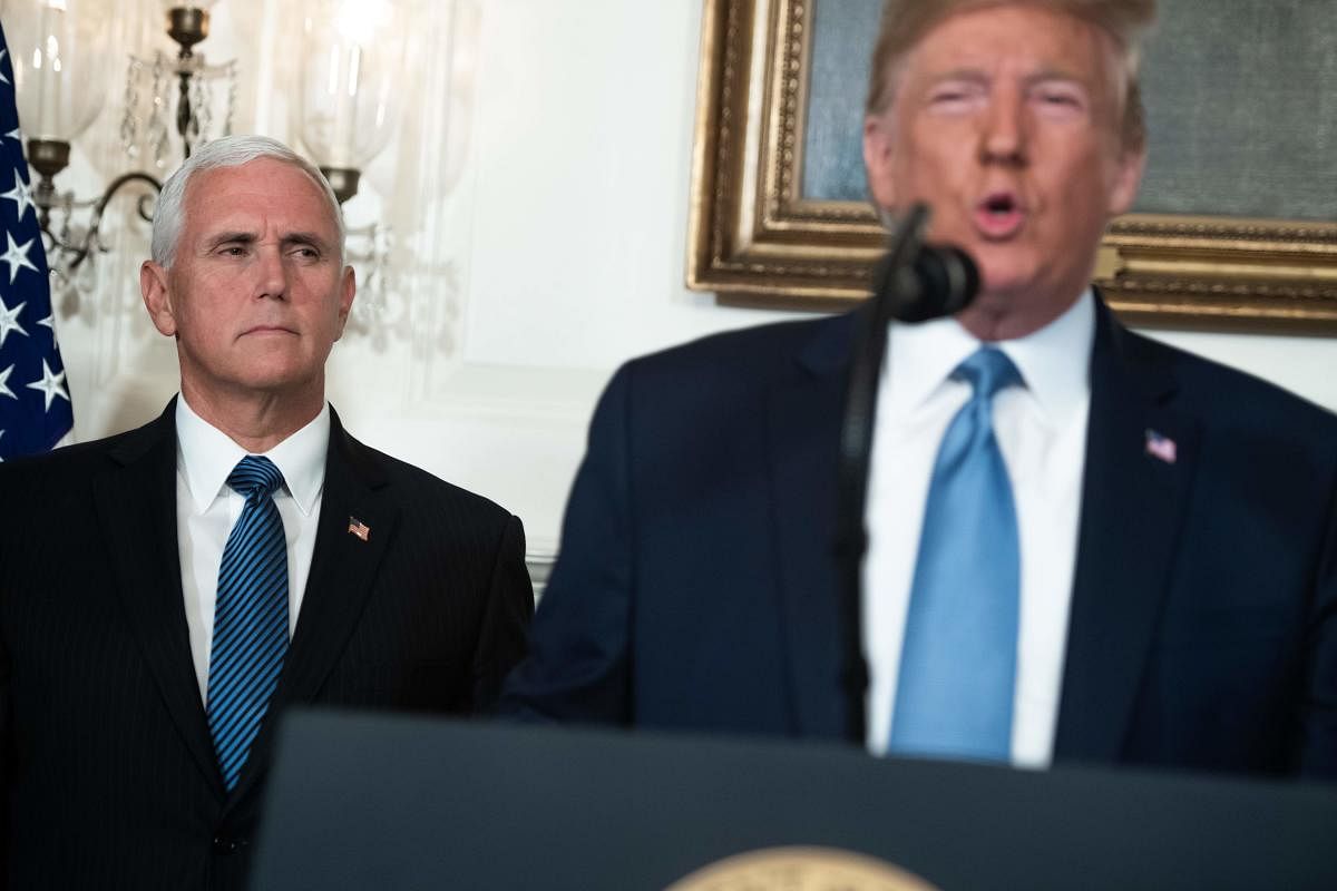 US President Donald Trump speaks alongside Vice President Mike Pence about the mass shootings from the Diplomatic Reception Room of the White House in Washington, DC, August 5, 2019. (Photo by SAUL LOEB / AFP)
