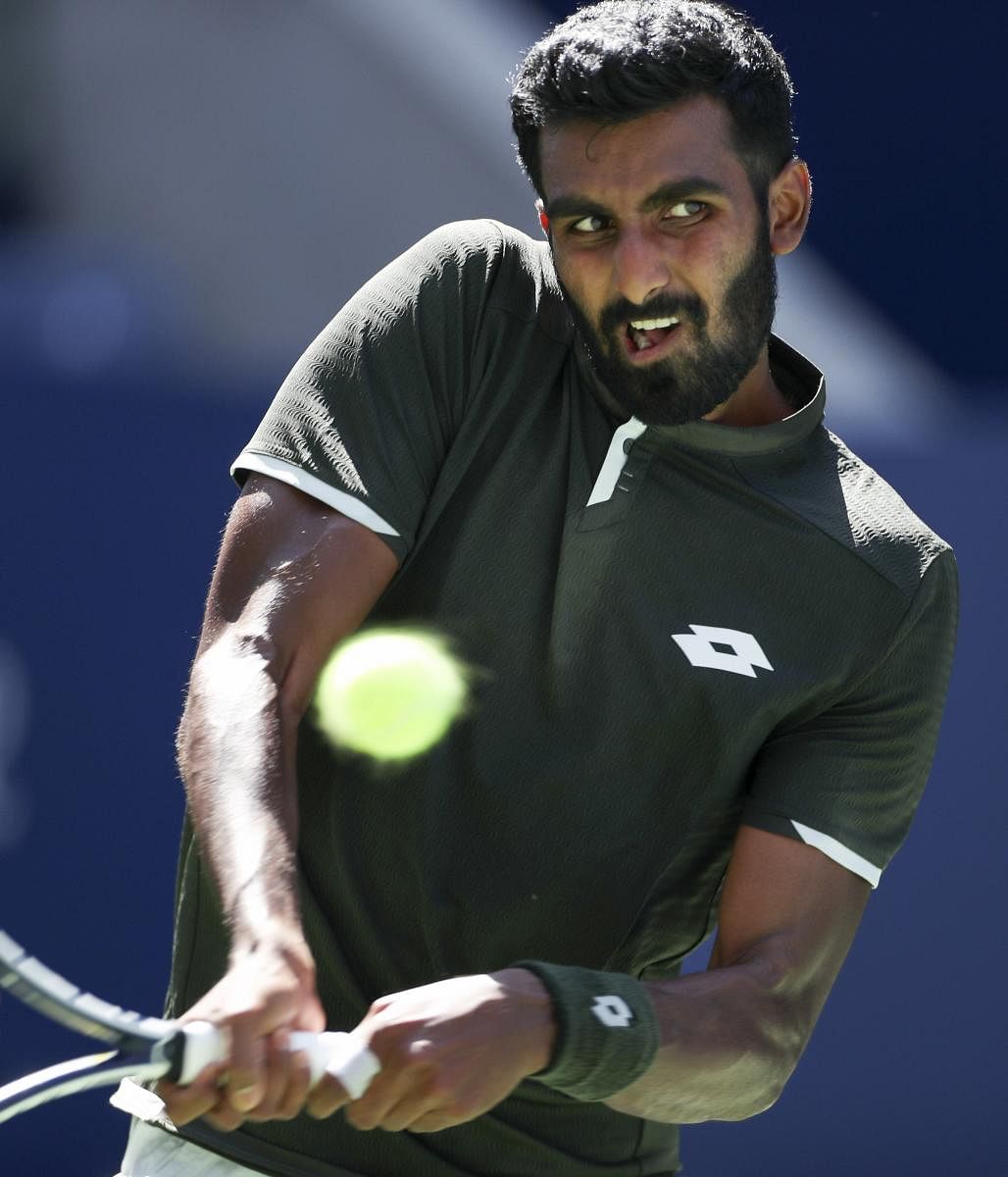 Prajnesh Gunneswaran, of India, against Daniil Medvedev, of Russia, during the first round of the US Open tennis tournament Monday, Aug. 26, 2019, in New York. AP/PTI
