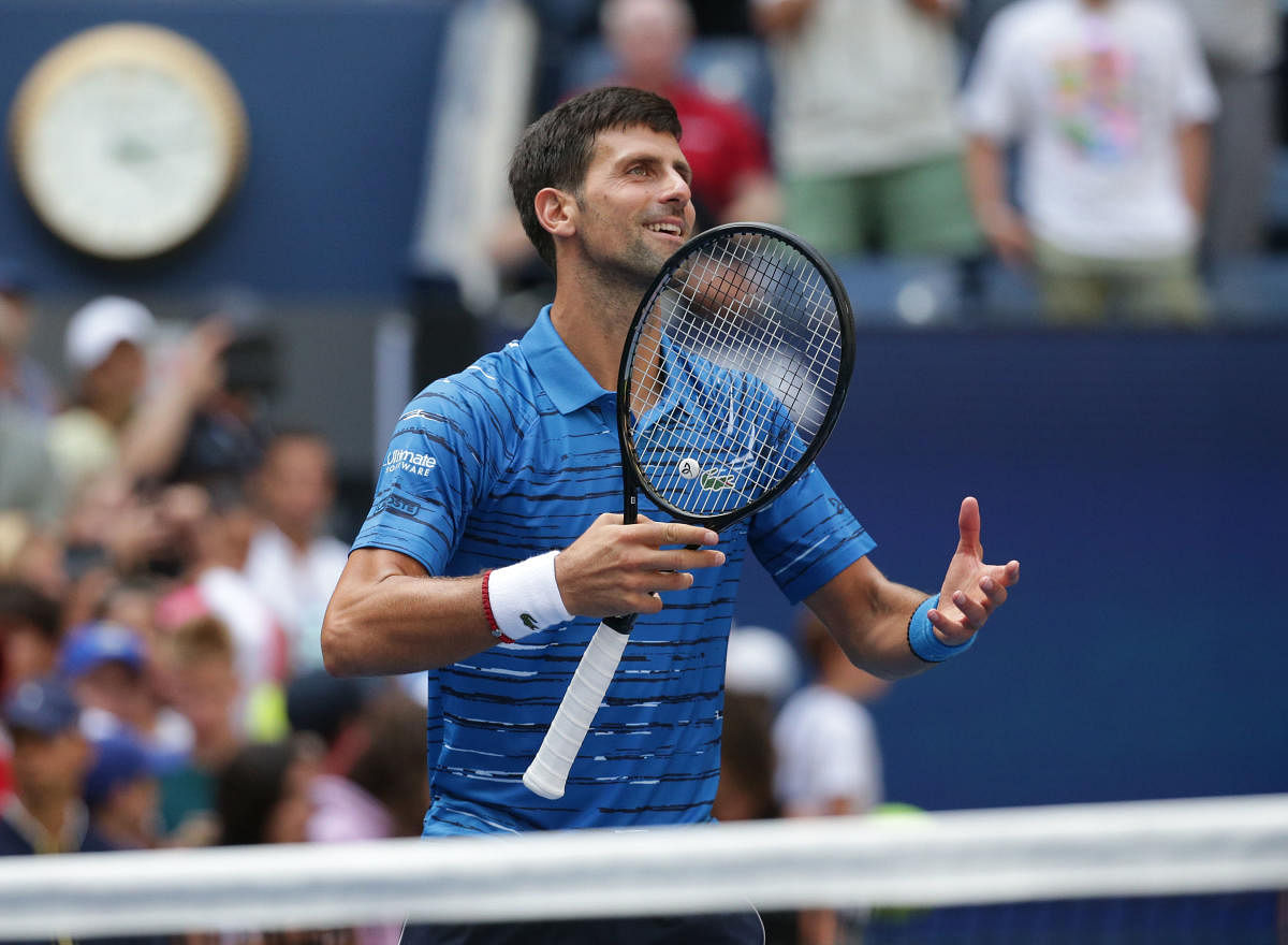 Novak Djokovic of Serbia celebrates match point against Roberto Carballes Baena of Spain in a first round match on day one of the 2019 U.S. Open tennis tournament at USTA Billie Jean King National Tennis Center. Photo/Jerry Lai-USA TODAY Sports