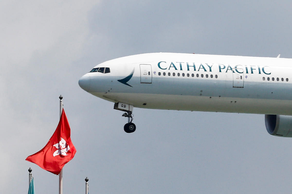 A Cathay Pacific Boeing 777-300ER plane lands at Hong Kong airport after it reopened following clashes between police and protesters, in Hong Kong, China August 14, 2019. REUTERS/Thomas Peter/File Photo