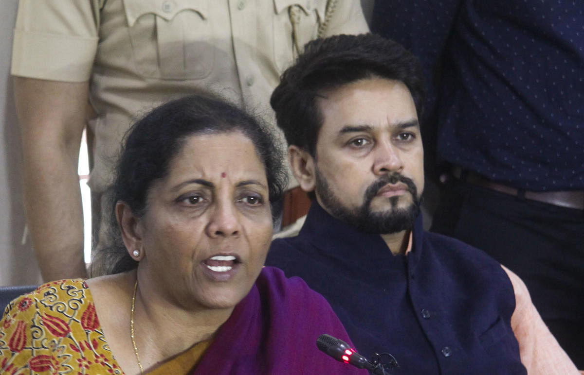 Finance Minister Nirmala Sitharaman along with Minister of State Anurag Thakur addresses a press conference in Pune (PTI Photo) 