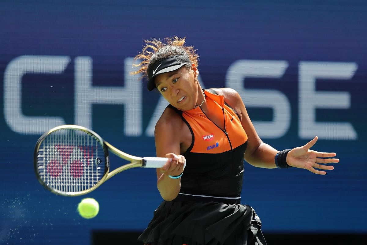Naomi Osaka of Japan returns a shot against Anna Blinkova of Russia during their Women's Singles first round match on day two of the 2019 US Open at the USTA Billie Jean King National Tennis Center on August 27, 2019 in the Flushing neighborhood of the Queens borough of New York City. Elsa/Getty Images/AFP 
