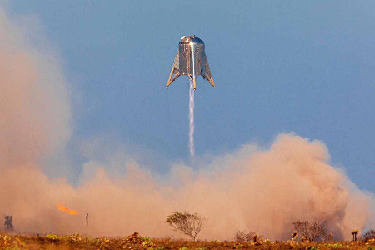 SpaceX's Mars Starship prototype "Starhopper" hovers over its launchpad during a test flight in Boca Chica, Texas, U.S. August 27, 2019. REUTERS/Trevor Mahlmann
