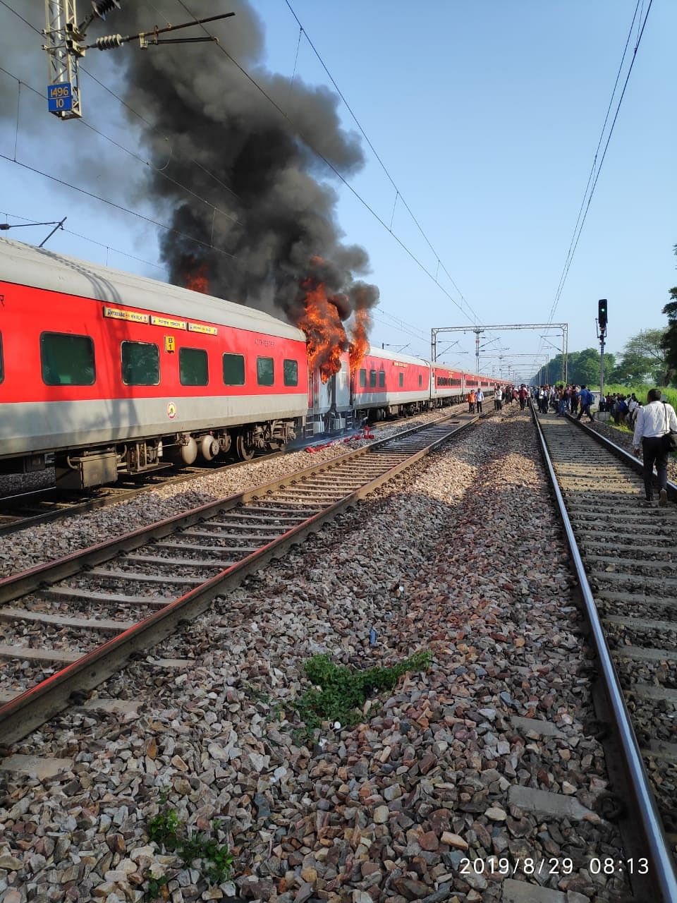Hyderabad- New Delhi Telangana Express caught fire near Ballabgarh in Haryana on Thursday morning. (DH Photo)