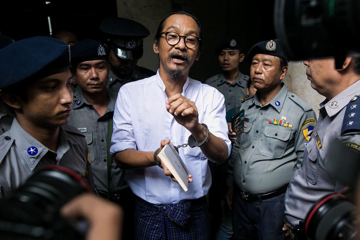 Myanmar human rights activist and film director Min Htin Ko Ko Gyi speaks to journalists after a court verdict in Yangon on August 29, 2019. (AFP)
