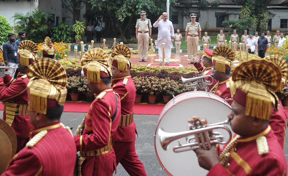 Home Minister Basavaraj Bommai receives the guard of honour at the DG&amp;IGP's office in Bengaluru on Thursday. DH Photo