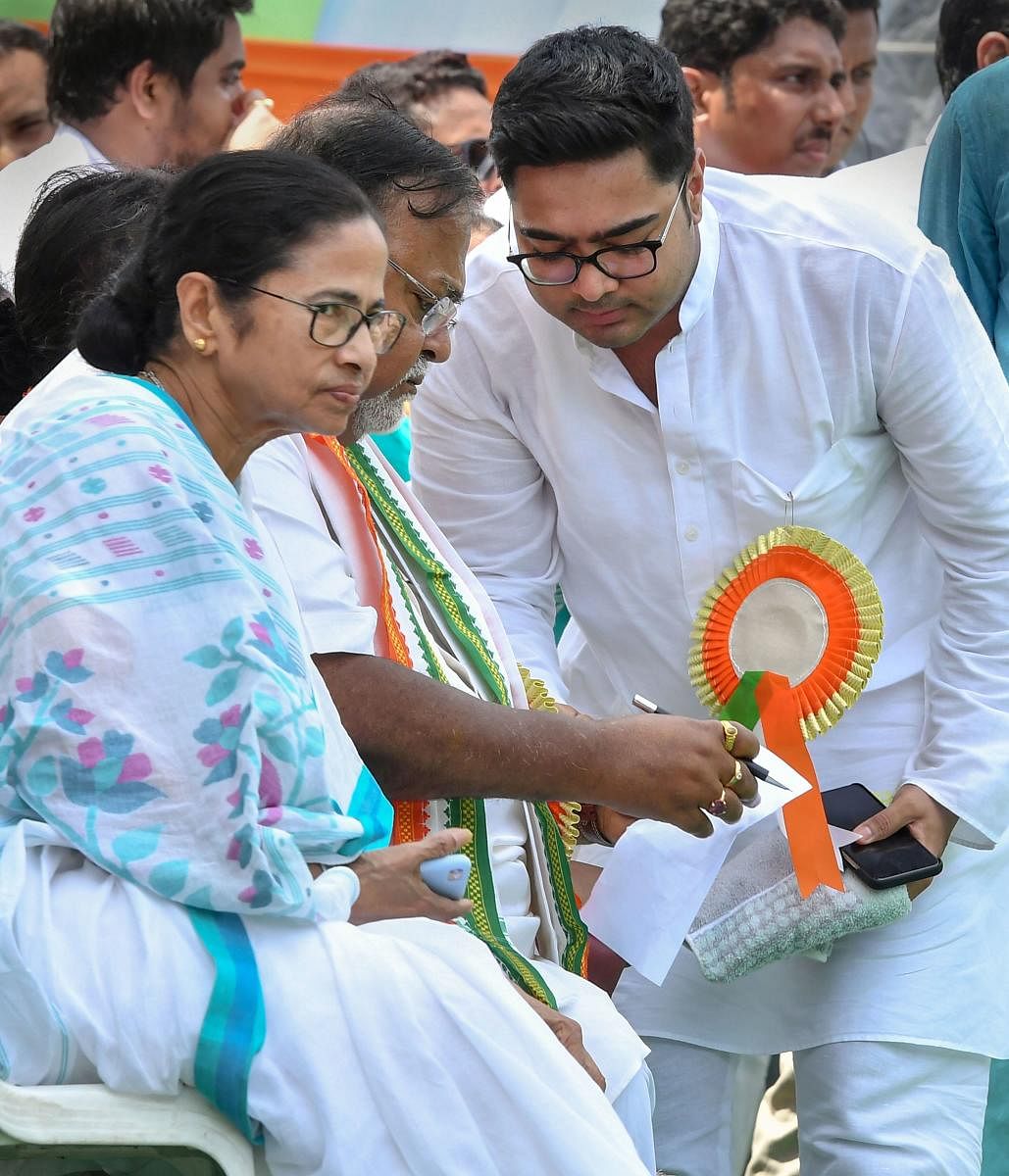 (From left) West Bengal Chief Minister Mamata Banerjee, Education Minister Partha Chatterjee and MP Abhishek Banerjee during Trinamool Chhatra Parishad Foundation Day rally, in Kolkata on Wednesday. PTI