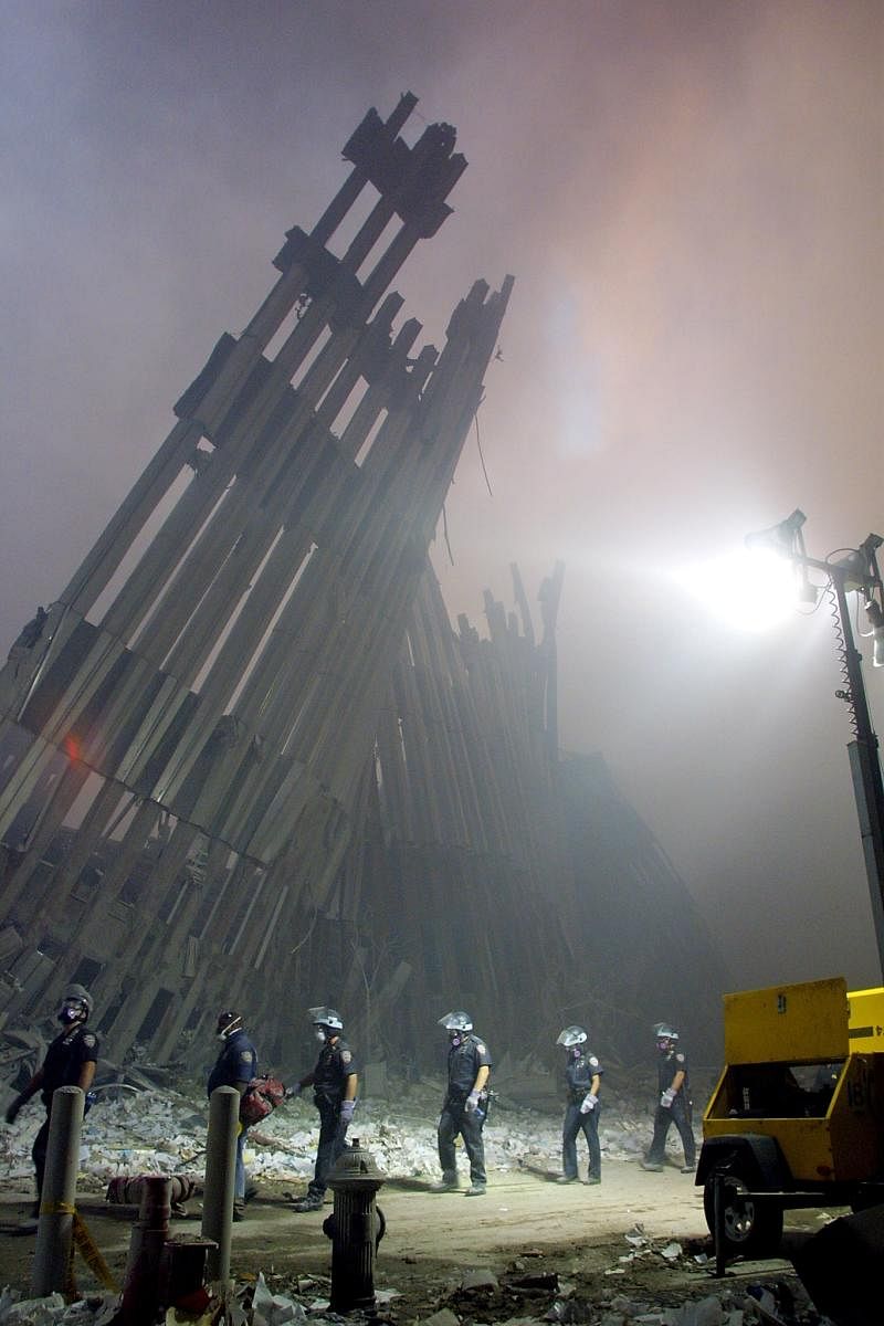 In this file photo taken on September 11, 2001, firefighters make their way through the rubble of the World Trade Center in New York after two hijacked planes flew into the landmark skyscrapers. AFP file photo