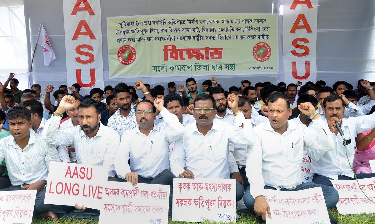 Guwahati: Activists of All Assam Students Union (AASU) hold placards during a protest in Guwahati, Assam. (PTI Photo)