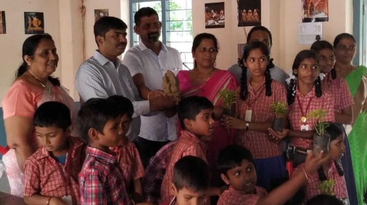 Members of Eco Friends Group distributed clay Ganesha idols and saplings to the schoolchildren of Zilla Panchayat Higher Primary School at Kadri.