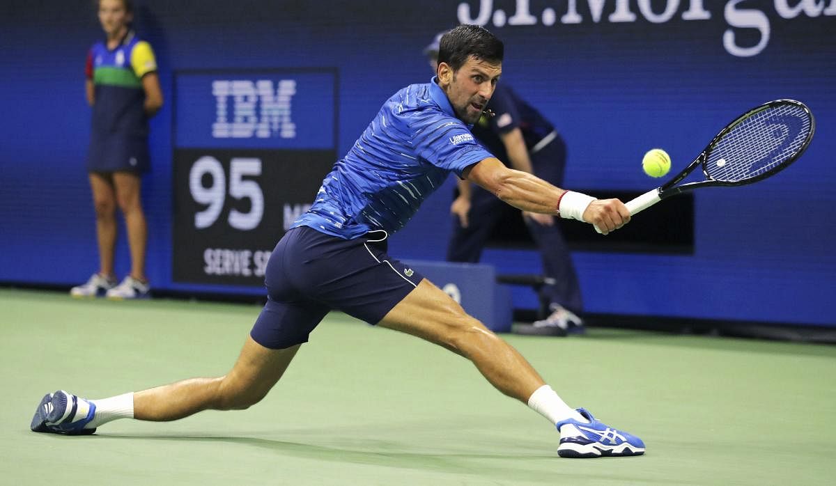 Novak Djokovic, of Serbia, stretches for a return to Denis Kudla during the third round of the U.S. Open tennis championship. (PTI Photo)