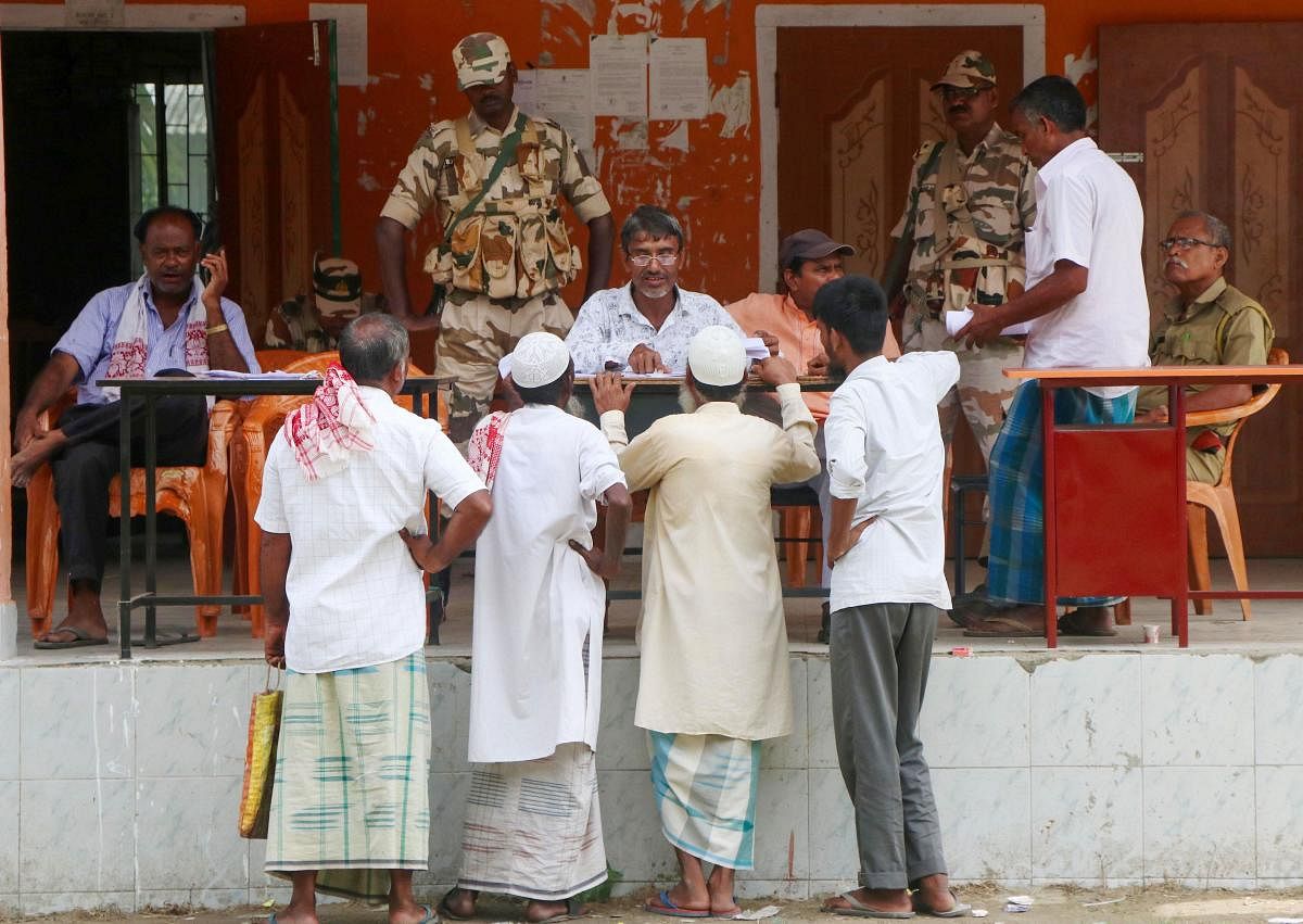 People to check their names on the final list of the National Register of Citizens (NRC), in Kamrup. (PTI Photo)