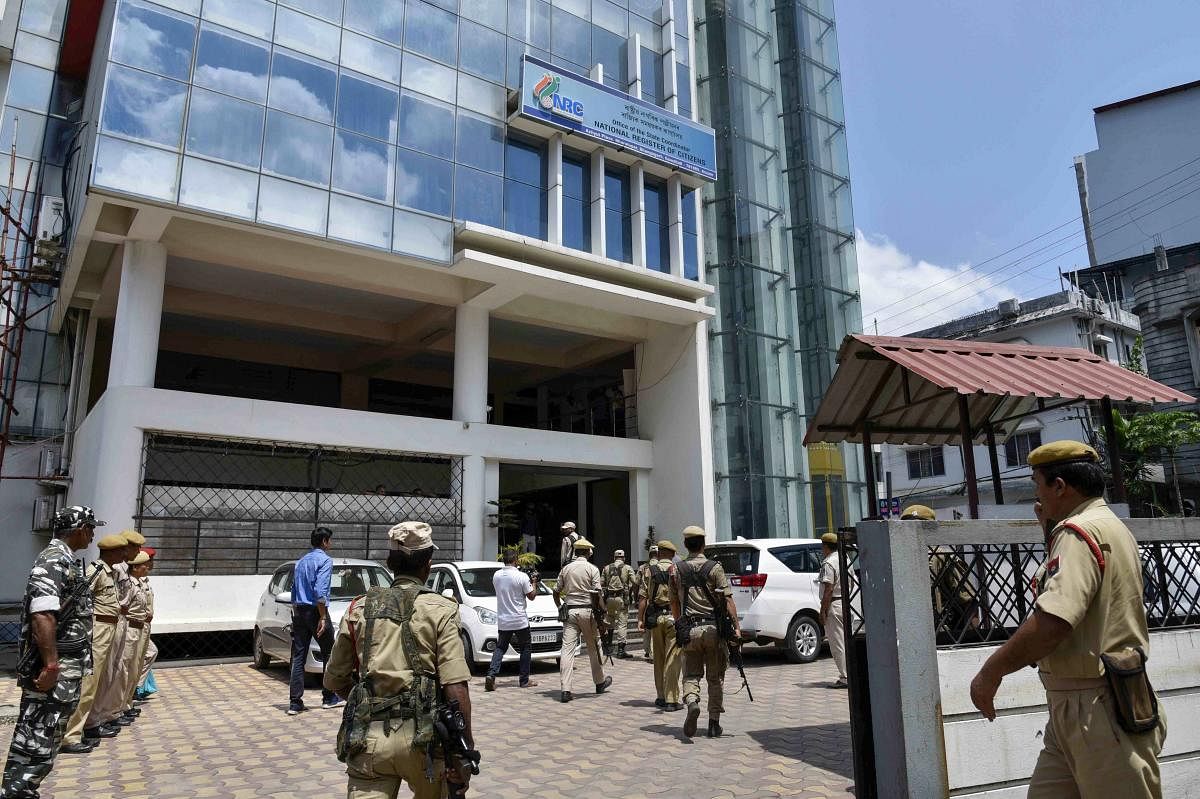 Security personnel stand guard outside an NRC centre before the final draft publication in Guwahati. The NRC with the final list of citizens will be published on August 31, 2019. Chief Minister of Assam Sarbananda Sonowal has asked people not to panic, and has directed all Government agencies of Assam to cooperate with people. PTI