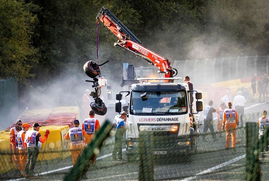 Juan Manuel Correa's crashed car remains being cleared at the Spa-Francorchamps in Belgium. Picture credit: AFP