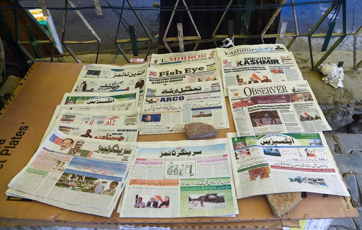 Newspaper obits have become the only means by which Kashmir residents become aware of the deaths of their near and dear ones amid a communication blockade. AFP File Photo