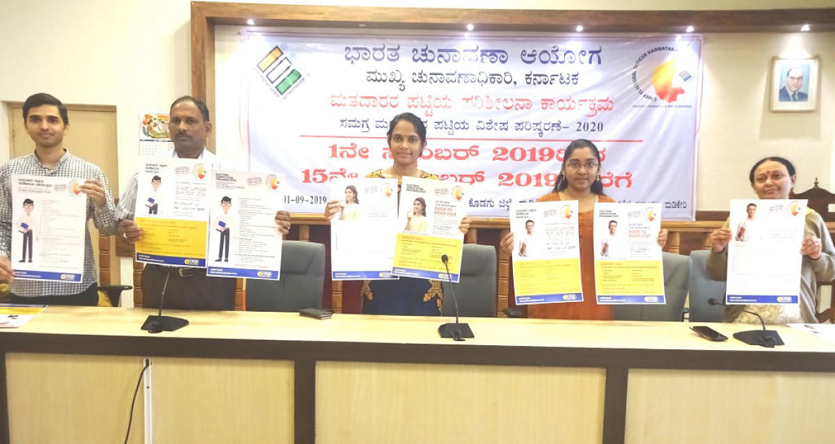 Deputy Commissioner Annies Kanmani Joy and  Zilla Panchayat Chief Executive Officer K Lakshmi Priya among others, release the poster on Electors Verification Programme during a programme  at the DC’s office hall in Madikeri on Sunday.