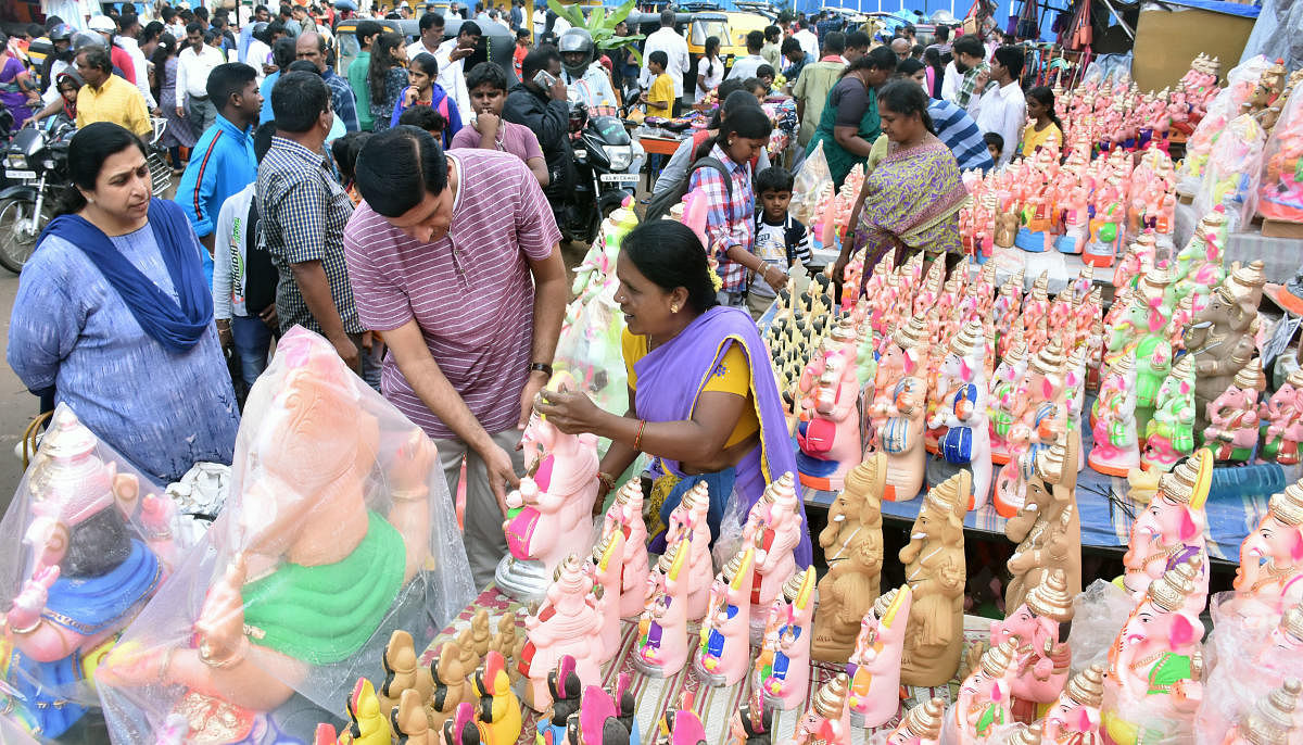 Vendors selling Gowri-Ganesha idols did brisk business on the eve of the festival in Mysuru.