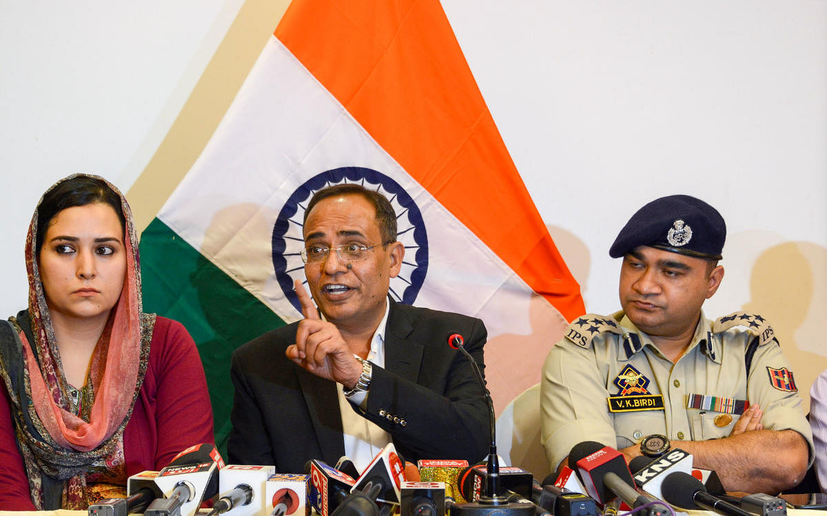 Jammu and Kashmir Government spokesperson Rohit Kansal along with Deputy Inspector General of Police (DIG) V.K Birdi addresses a press conference on the 29th day of restrictions, in Srinagar. (PTI Photo)