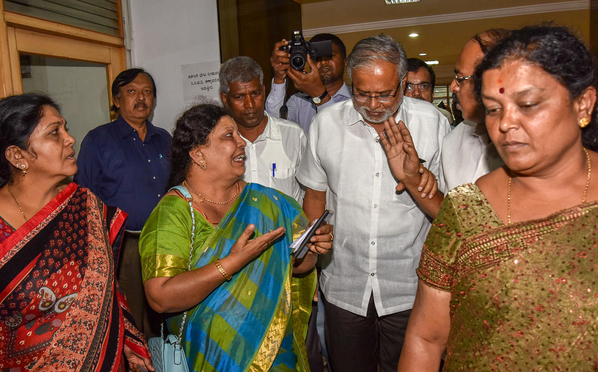 Primary and Secondary Education Minister Suresh Kumar ineracts with teachers after a meeting on transfers in Bengaluru on Tuesday. DH Photo