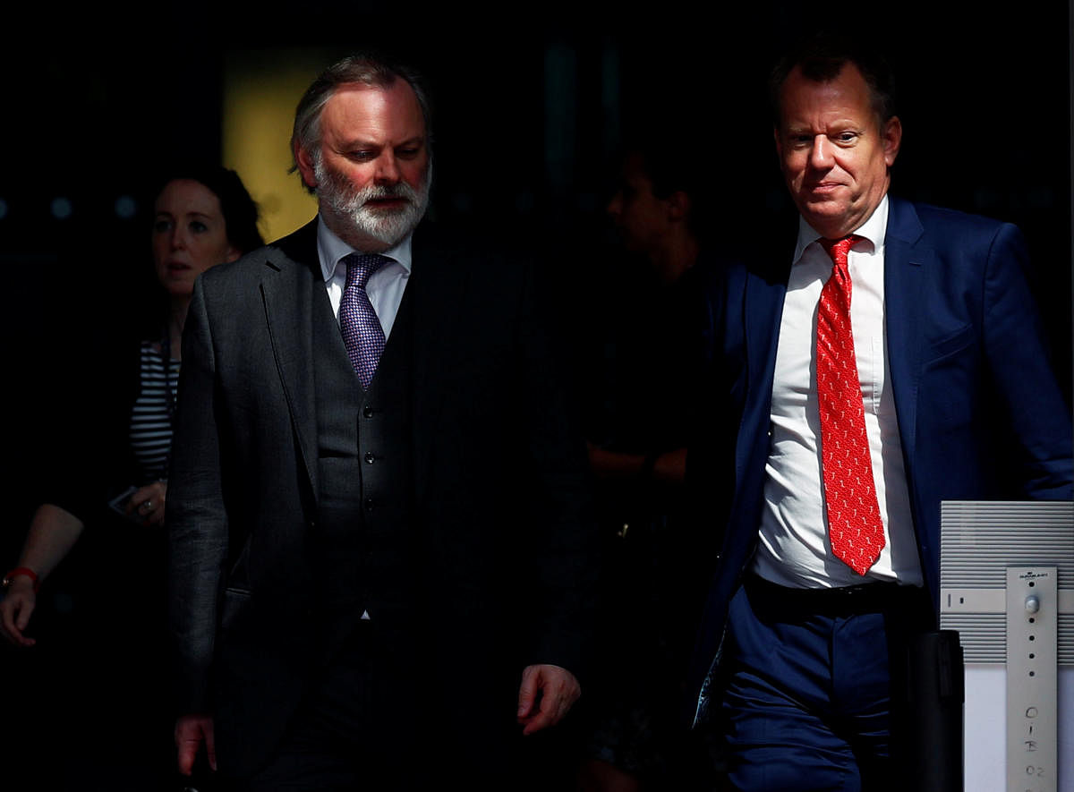 Britain's Ambassador to the European Union Tim Barrow and British Prime Minister Boris Johnson's Europe adviser David Frost leave the European Commission headquarters after a meeting with officials in Brussels. (Reuters Photo)