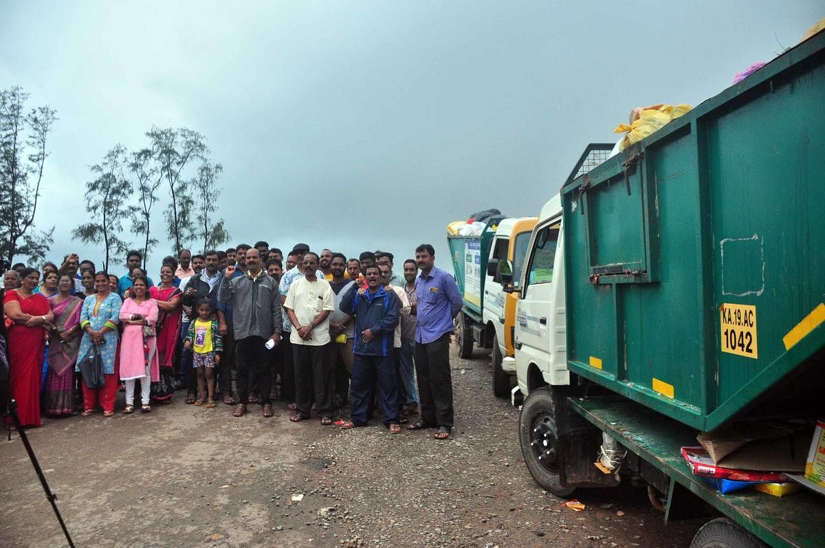 Residents at the MUDA site in Someshwara stage a protest on Tuesday.