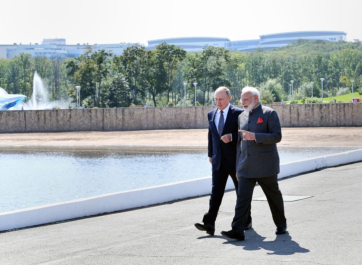 Prime Minister Narendra Modi meets with the Russian President Vladimir Putin on his two-day visit, at Vladivostok. (PTI photo)