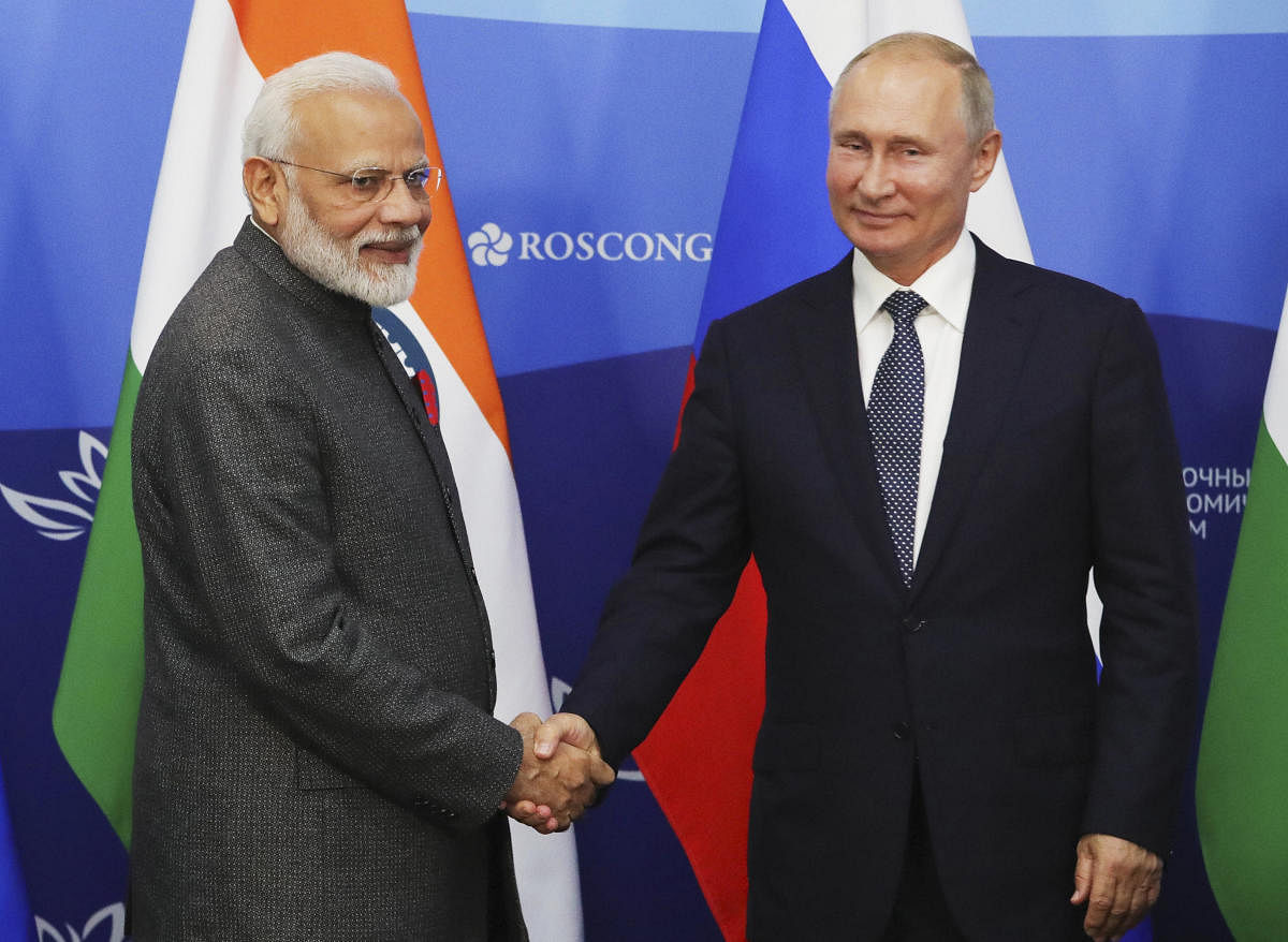 Russian President Vladimir Putin, right, and Indian Prime Minister Narendra Modi shake hands prior to their talks at the 5th Eastern Economic Forum in Vladivostok, Russia. AP/PTI photo