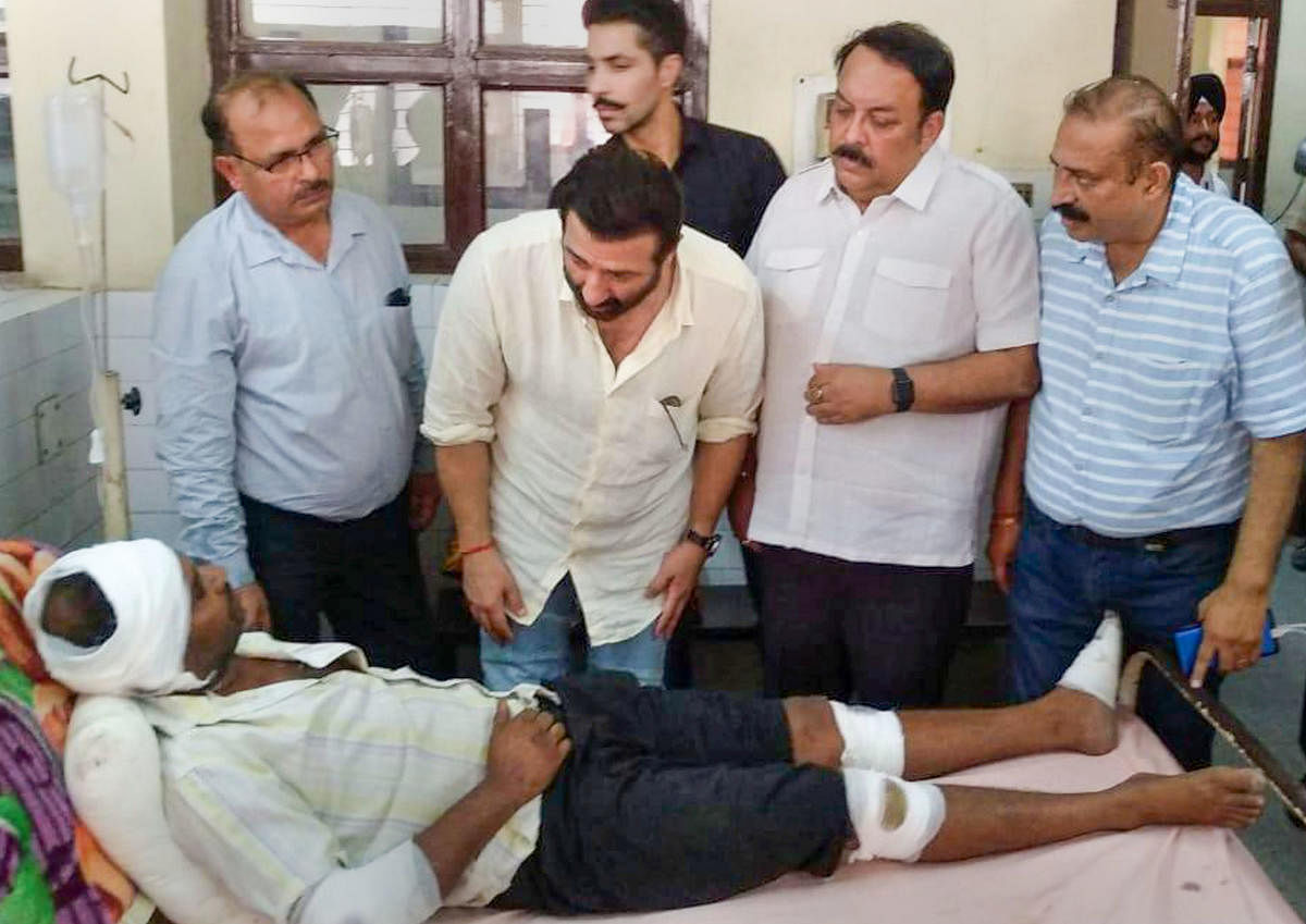 Actor and local BJP MP Sunny Deol visits an injured victim of the Batala fireworks factory blast, at the civil hospital in Gurdaspur district of Punjab, Thursday, Sept 5, 2019. (PTI Photo)