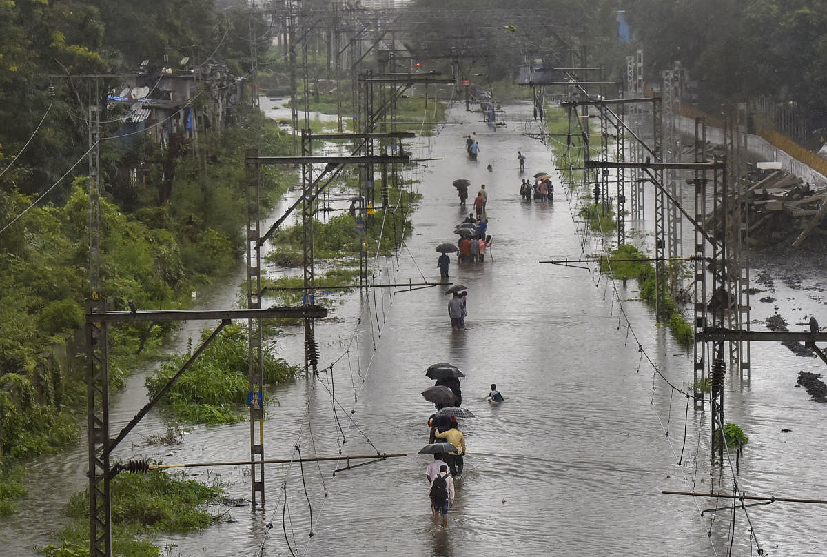 People living adjacent to salt pans near the Vasai Road station were badly affected as flood water entered their houses. PTI