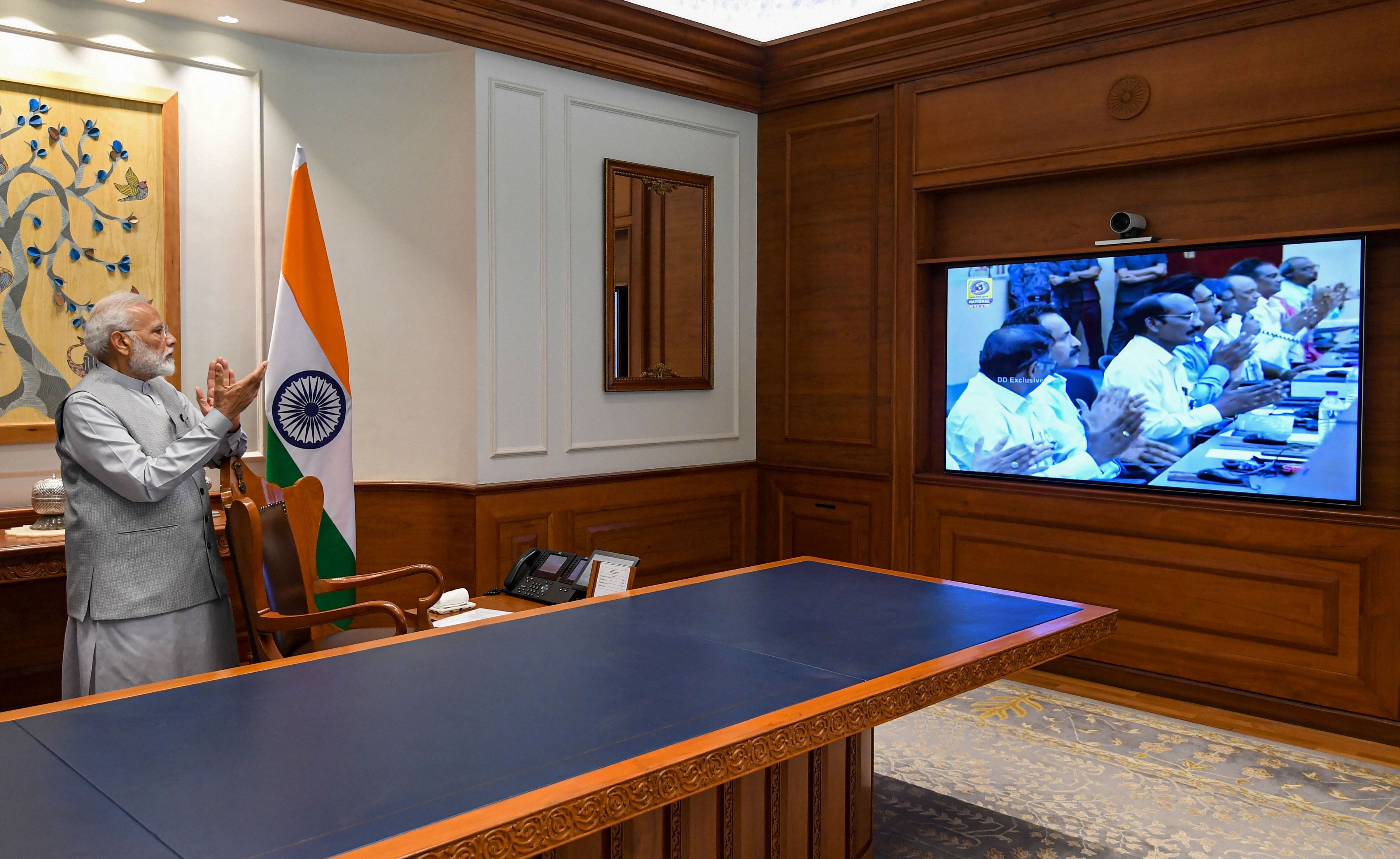 Prime Minister Narendra Modi applauds as he watches on a screen the successful launch of Chandrayaan-2 by GSLV MkIII-M1 vehicle from Satish Dhawan Space Centre of Sriharikota, in New Delhi, Monday, July 22, 2019. Photo/PTI
