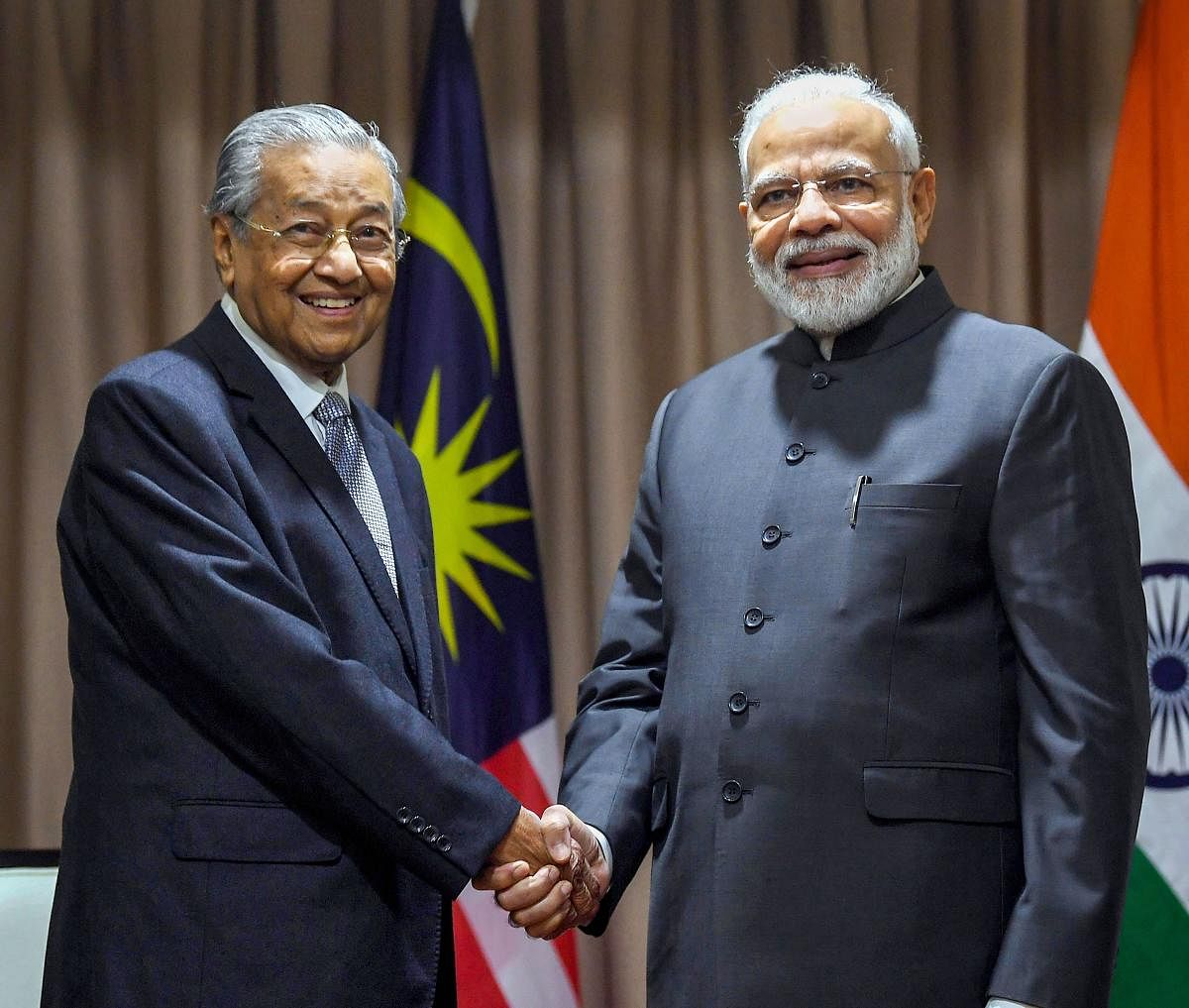 Prime Minister Narendra Modi shakes hands with his Malaysian counterpart Mahathir Mohamad, on the sidelines of 5th Eastern Economic Forum, at Vladivostok, in Russia, on September 5, 2019. PIB/PTI