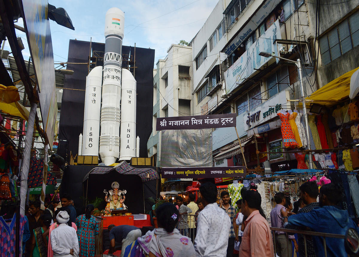 Devotees at a Ganesh 'Mandap' created on the theme of Chandrayaan-2 launch during Ganpati festival in Pune, Thursday, Sept 5, 2019. (PTI Photo)