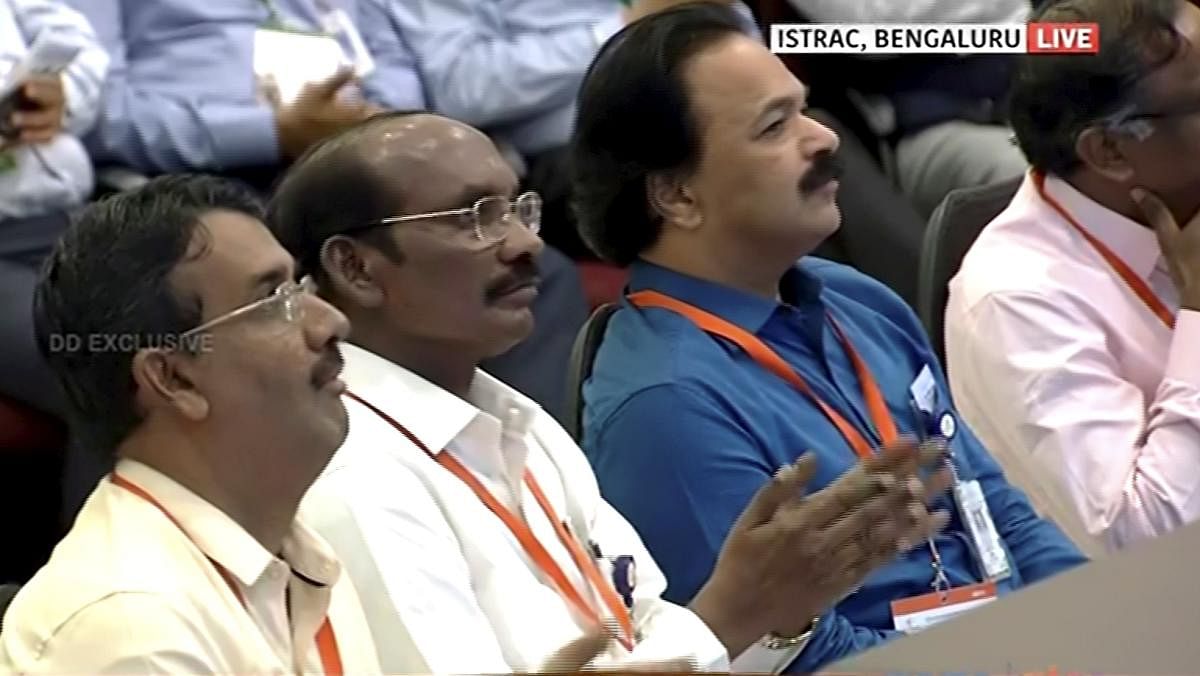 ISRO Chairman Kailasavadivoo Sivan (C) watches the live telecast of soft landing of Vikram module of Chandrayaan 2 on lunar surface. PTI Photo