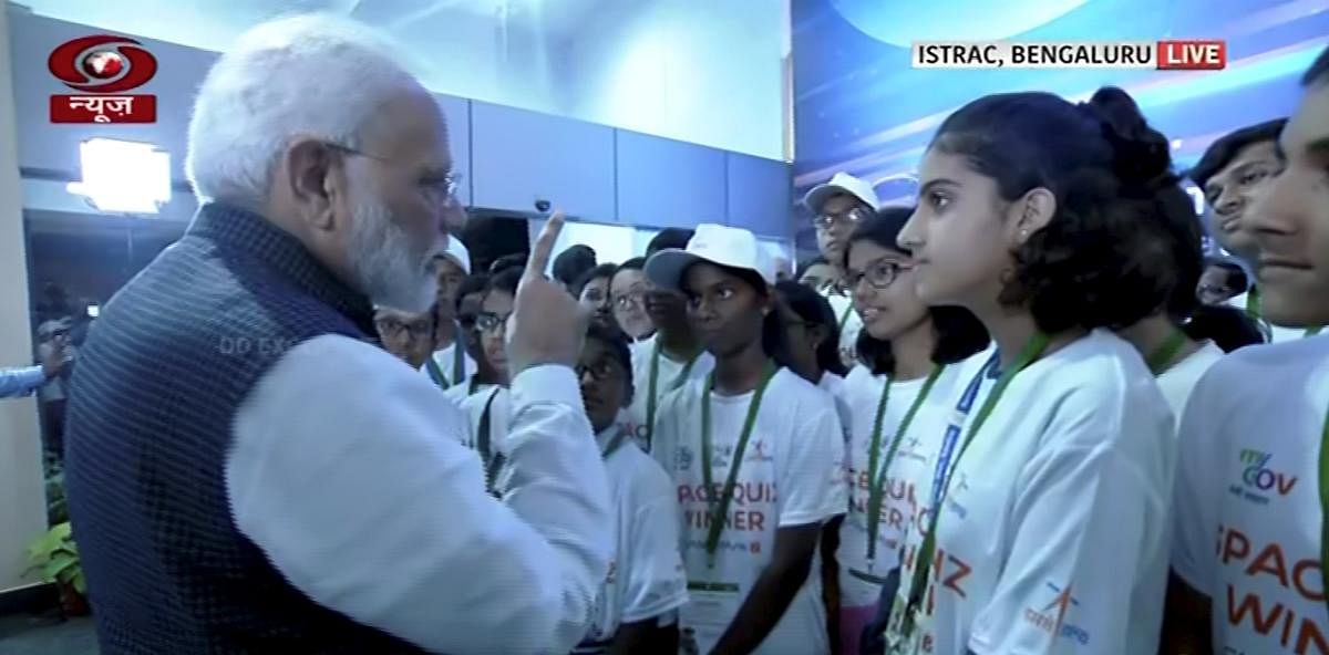 Prime Minister Narendra Modi interacts with students after connection with the Vikram lander was lost during soft landing of Chandrayaan 2 on lunar surface, in Bengaluru. (PTI Photo)