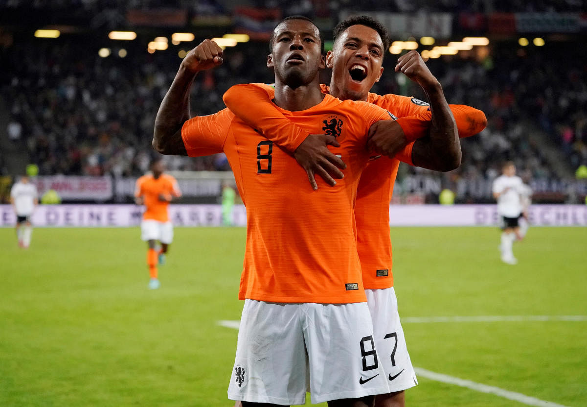 Netherlands' Georginio Wijnaldum celebrates scoring their fourth goal against Germany. (Reuters Photo)