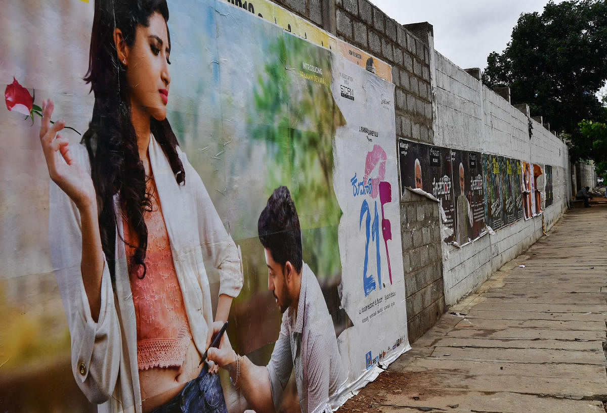 BBMP banned hoardings and posters a year ago, but they are still allowed inside movie halls.