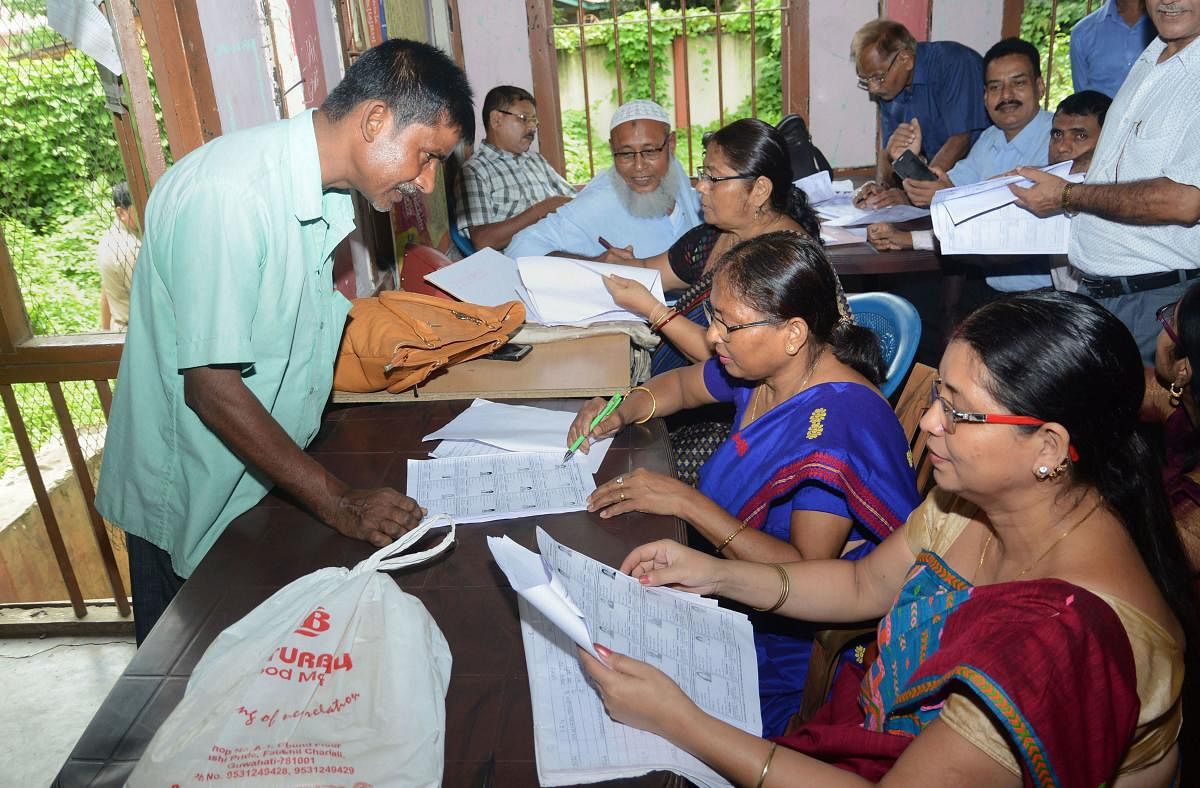 People check their names on the National Register of Citizens (NRC) final list at a National Register of Citizens office at Guwahati, Assam on Saturday. (PTI Photo)