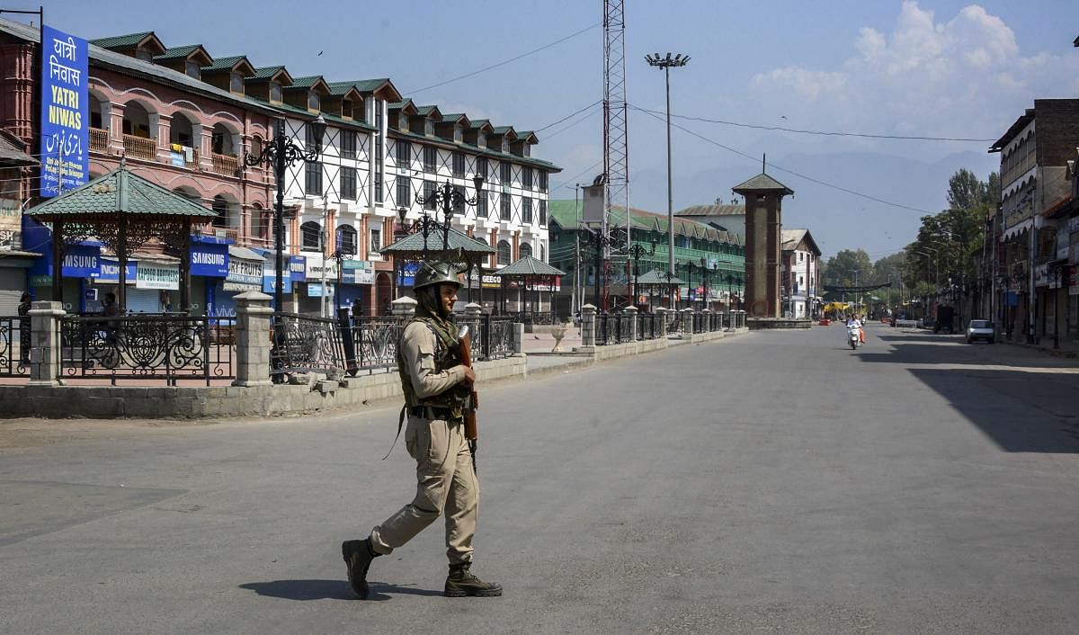 Commercial hub of Lal Chowk and adjoining areas were completely sealed off by placing concertina wires at all entry points where a large number of security force personnel were deployed, officials said. (PTI Photo)