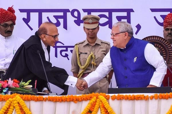 Rajasthan High Court Chief Justice Ravindra Bhat greets Governor Kalraj Mishra after he took oath of office, at a ceremony at Raj Bhawan in Jaipur, Monday, Sept 9, 2019. PTI Photo