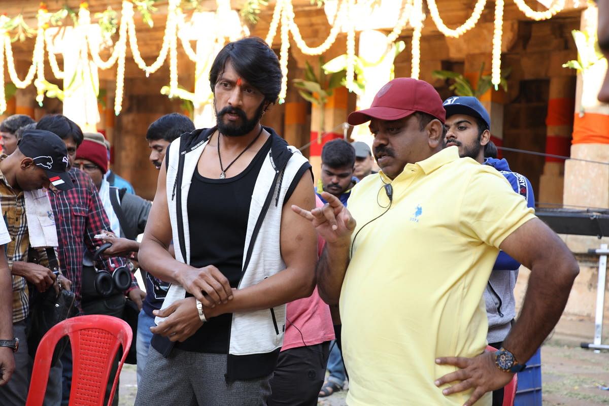 Director S Krishna (right) on the sets of 'Pailwaan' with Sudeep