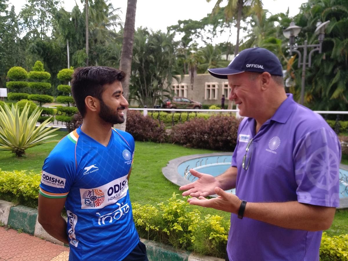 Indian men's hockey coach Graham Reid (right) interacts with captain Manpreet Singh at the SAI, Southern Centre, in Bengaluru on Tuesday. DH PHOTO/VIVEK MV 