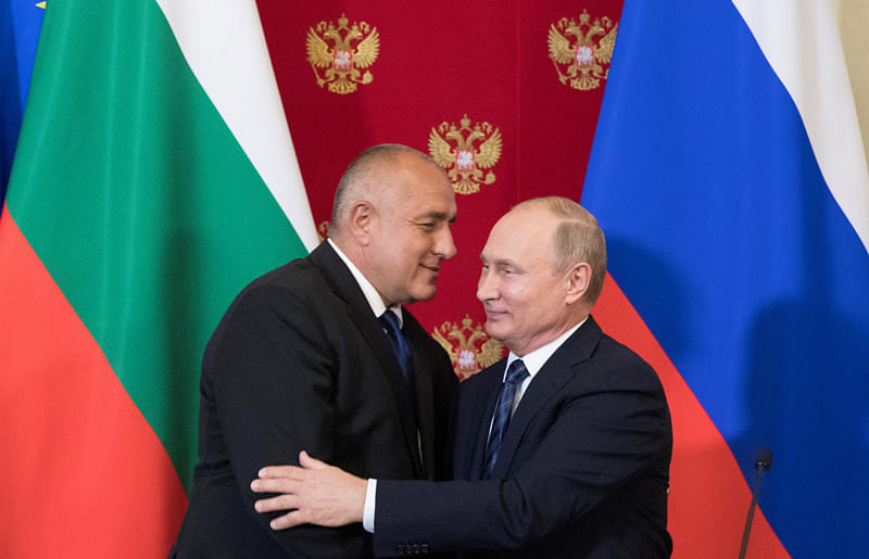 Russian President Vladimir Putin and Bulgarian Prime Minister Boyko Borissov hug each other after a joint news conference following their talks at the Kremlin in Moscow, Russia. (Reuters Photo)