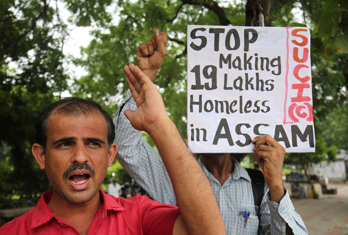 Activists of Socialist Unity Centre of India (SUCI) shout slogans during a protest against what they say is the final draft of the National Register of Citizens (NRC) in the northeastern state of Assam, in Ahmedabad, India, September 5, 2019. REUTERS/Amit