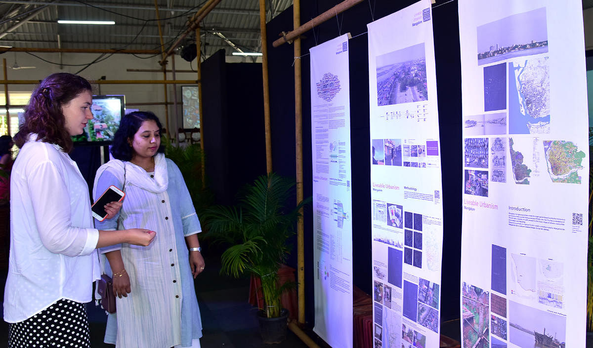 A student of Welsh School of Architecture (WSA) of Cardiff University explains the exhibition of their finding to Mangaluru Smart City Limited In-charge MD Snehal R,at Mini Town Hall in Mangaluru on Tuesday.